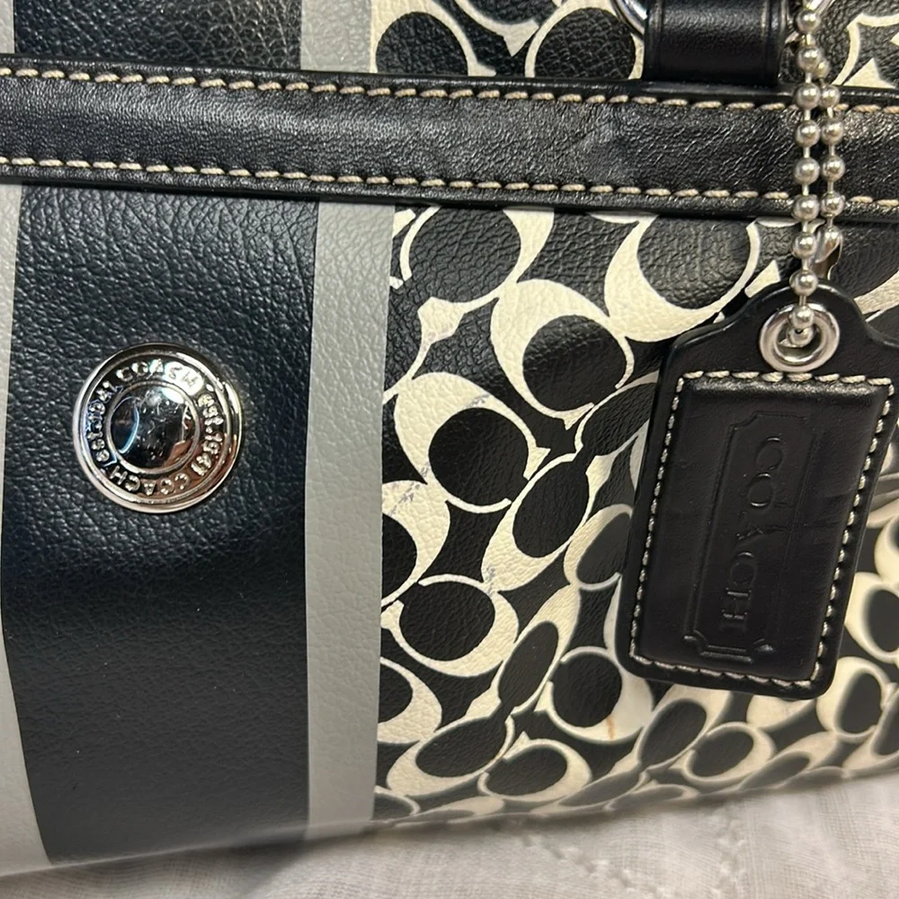 Coach boston leather travel bag with a tag